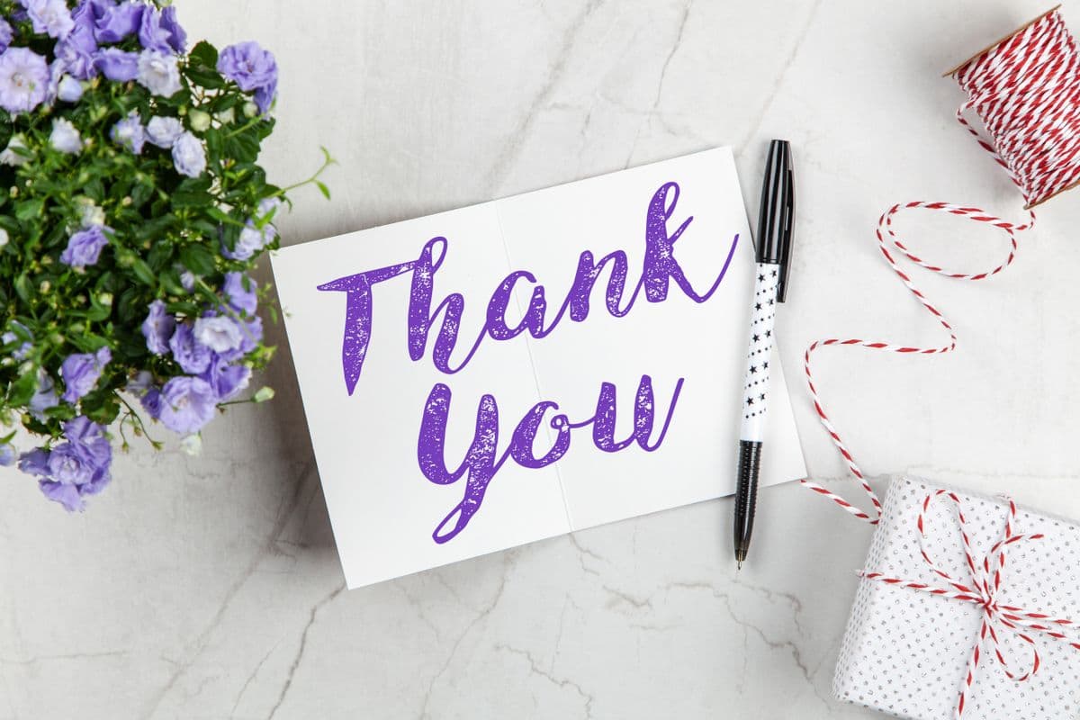 A thank-you note on a desk