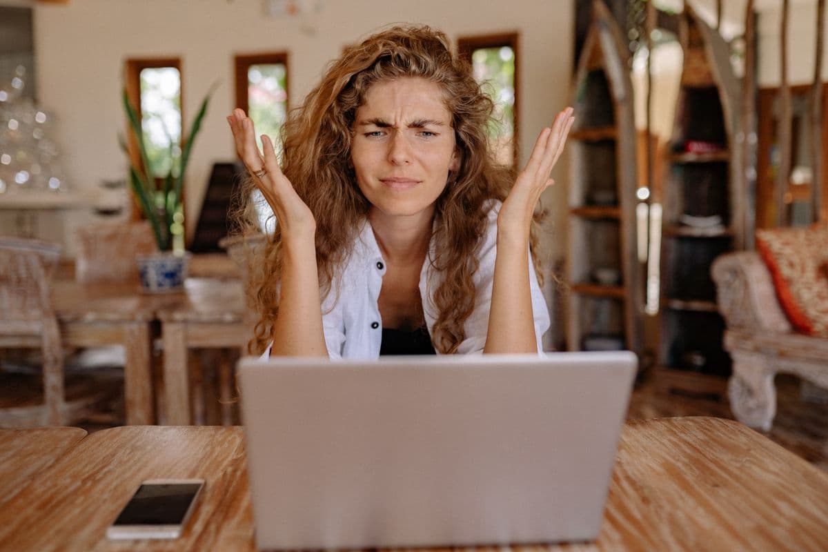 A frustrated customer at a laptop