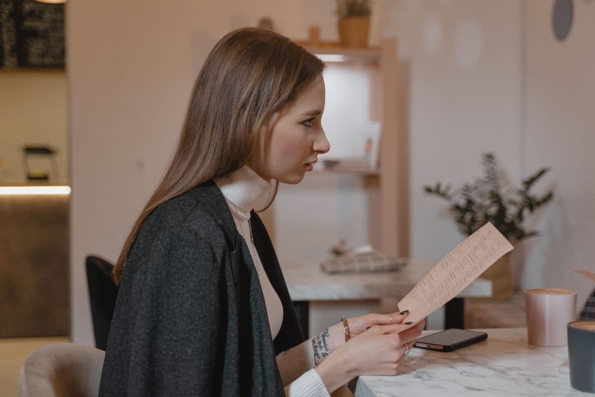 A diner checking reviews at a table