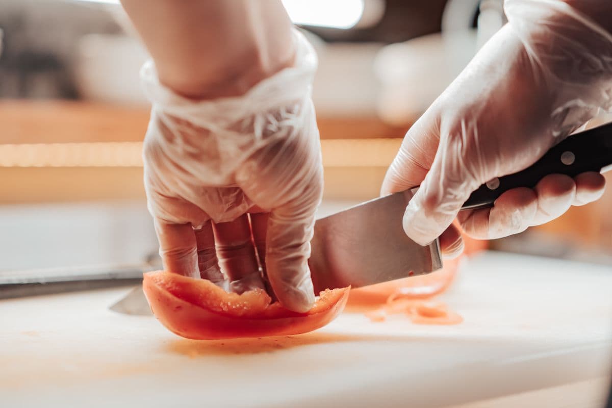 A chef in gloves preparing food