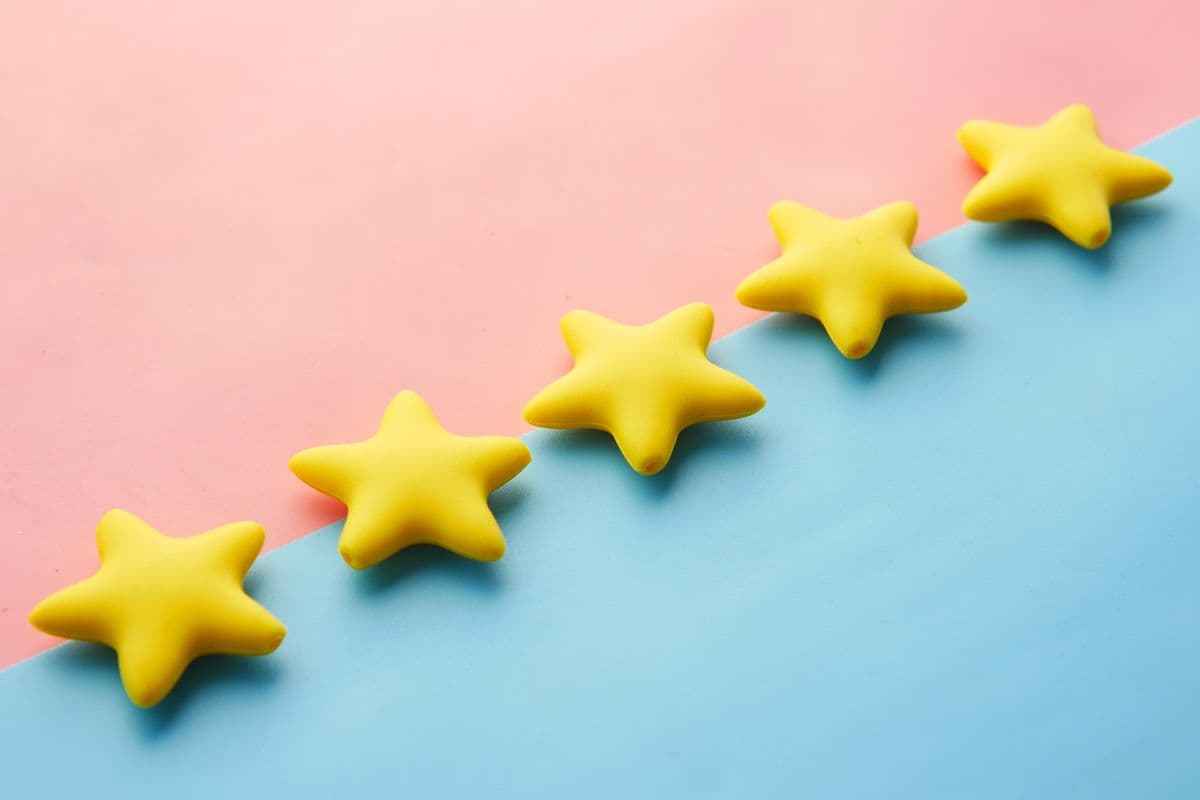 A five-star rating on a notepad
